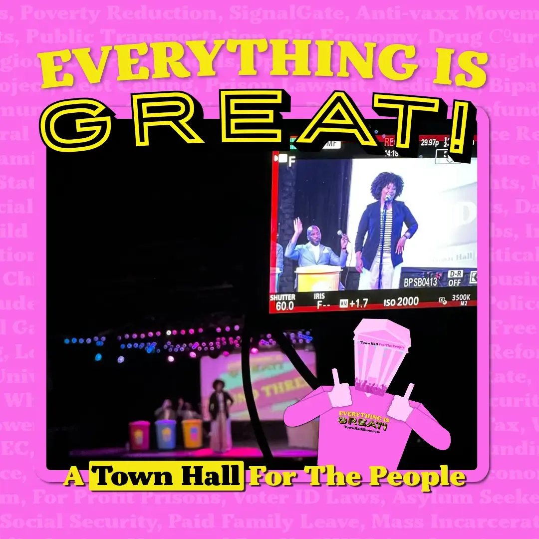 Video monitor view of Eunice Elliott on stage at Everything Is Great, a Town Hall for the People comedy show.